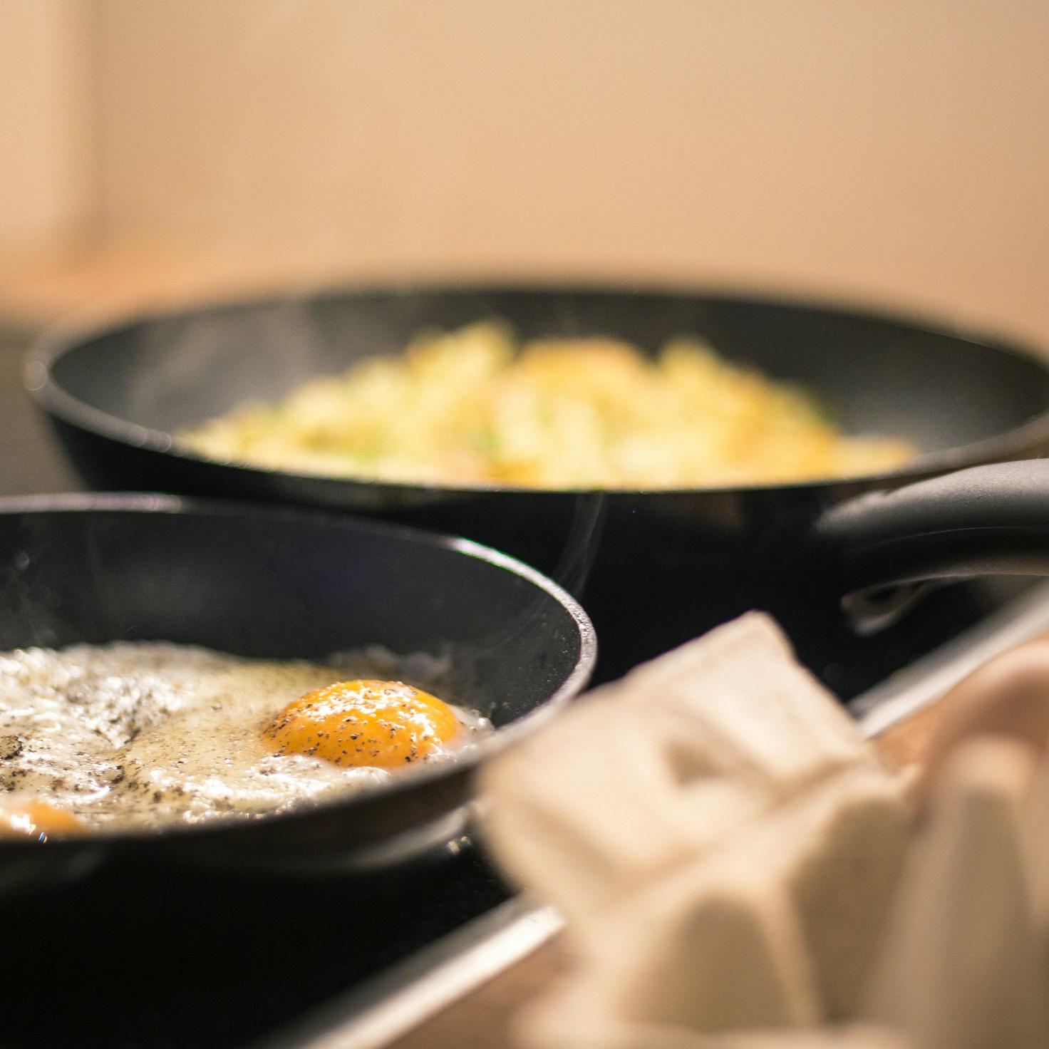 Community members collaborating in a contemporary kitchen, sharing recipes and techniques